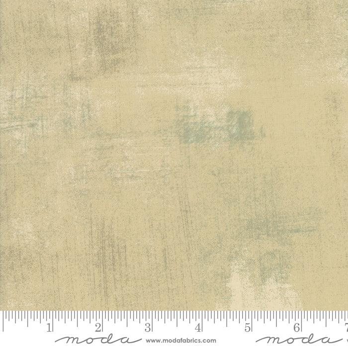 Moda Fabrics grunge tan cotton fabric with light blue distressed pattern