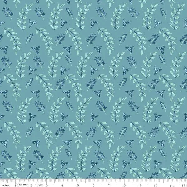 Teal leaf print fabric with scattered small foliage shapes