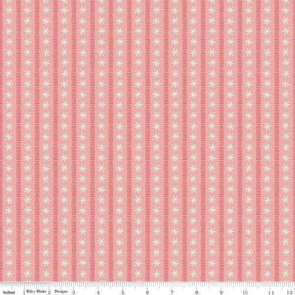 Coral pink cotton fabric with narrow white motif stripes, small repeating pattern
