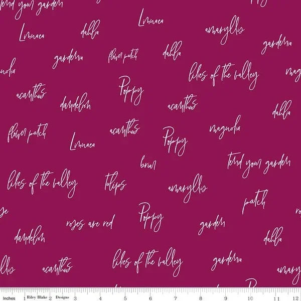 Burgundy fabric with white script word pattern, Riley Blake