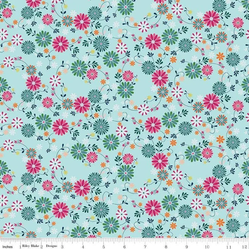 Blue floral wreath pattern fabric with scattered pink and teal flowers