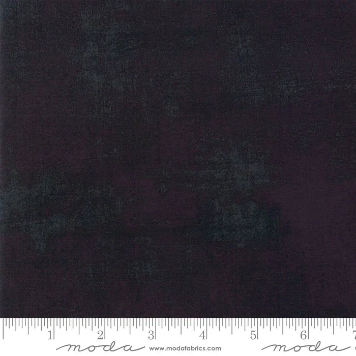 Black grunge fabric remnant with subtle distressed texture and mottled finish