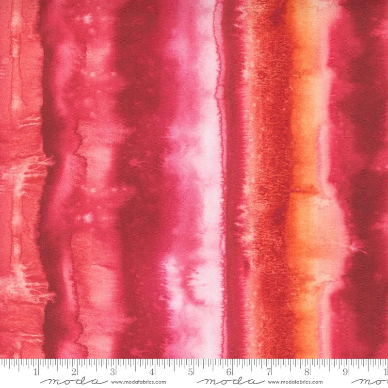Christmas cotton fabric with starflower motifs in red, pink, and orange vertical panels