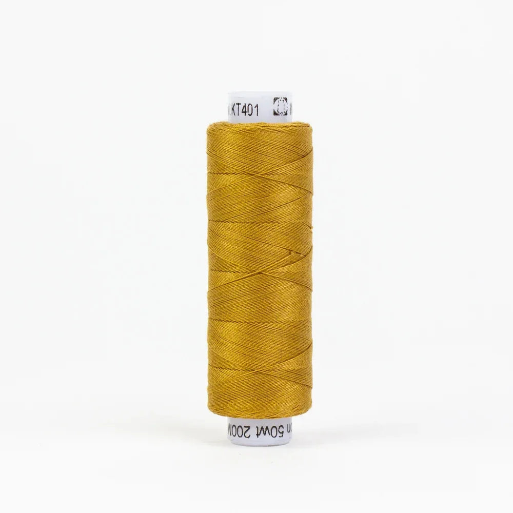 Dark gold embroidery thread spool wound on cardboard core