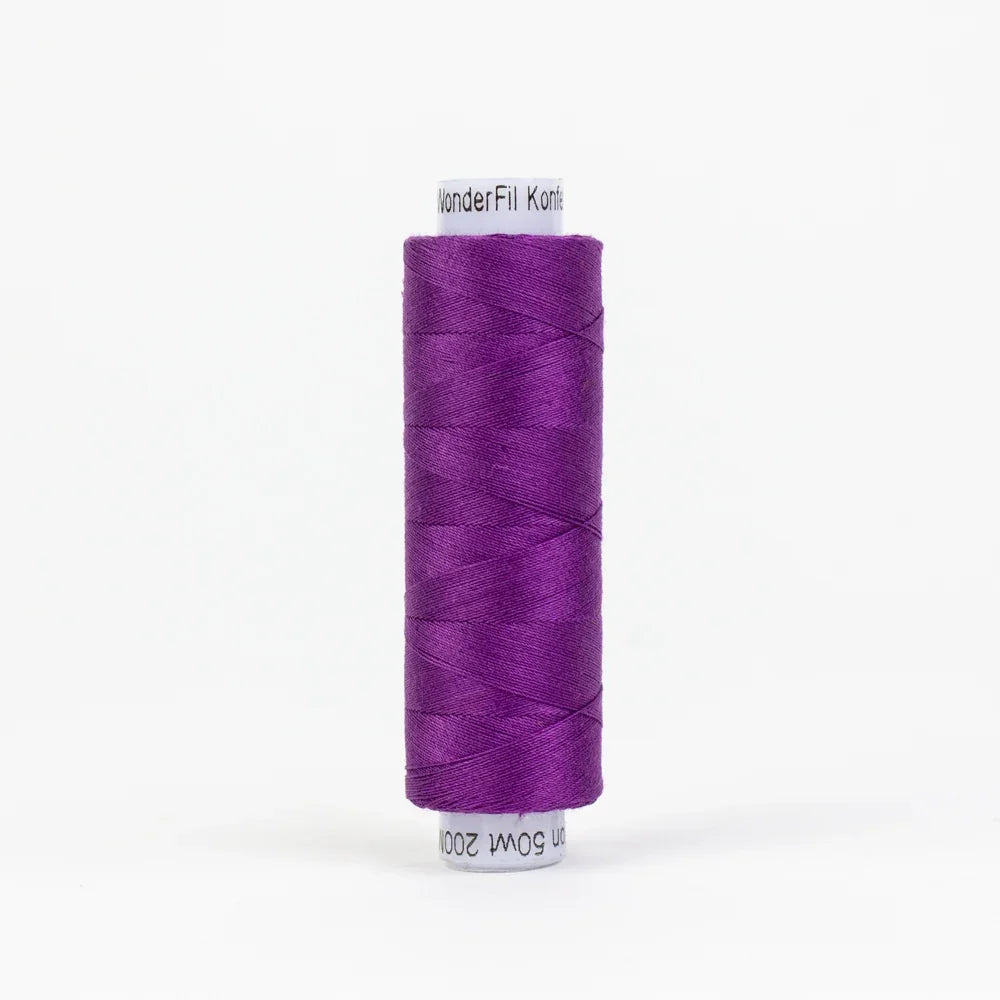 Purple sewing thread spool, wound on a roll