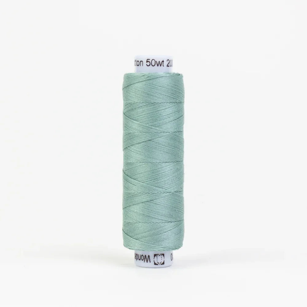 Teal sewing thread spool, tightly wound yarn