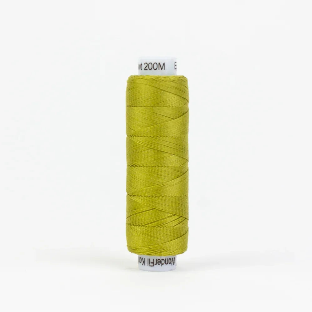 Green embroidery thread spool, wound on a white plastic bobbin