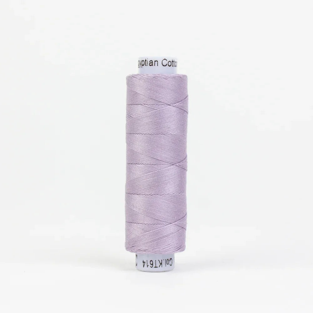 Mauve cotton thread spool, wound skein with visible thread strands