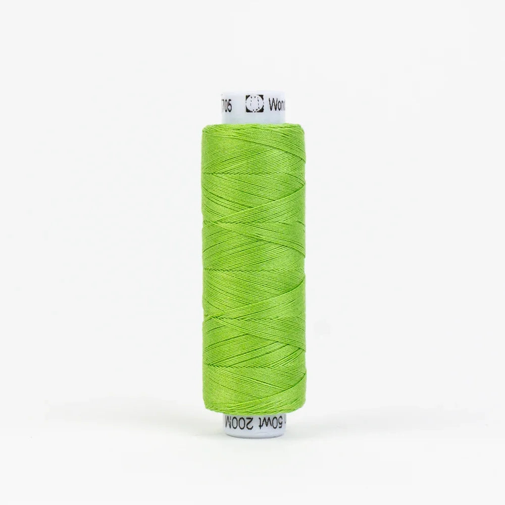 Green embroidery thread spool, wound on white label core