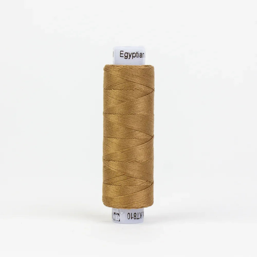 Warm brown thread spool with Egyptian label