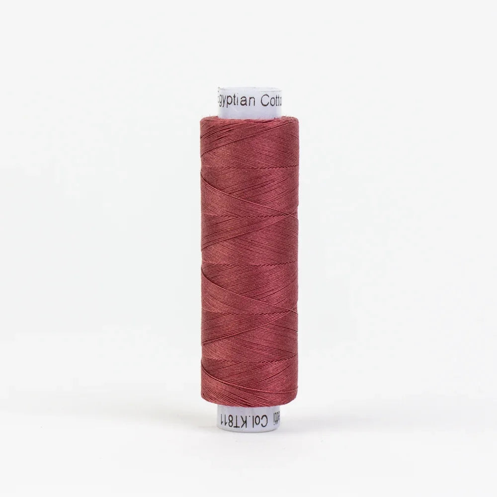 Barn red cotton thread spool, wound on a white core with small brand label.