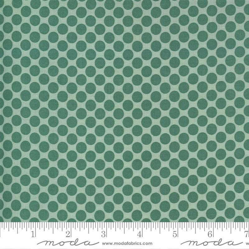 Green polka dot cotton fabric