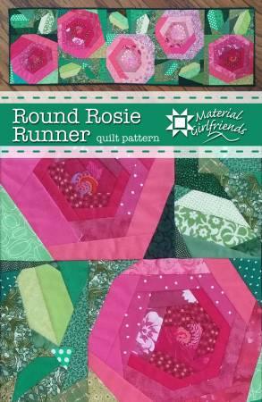 Quilt runner quilt top with pink circular medallions and green pieced panels