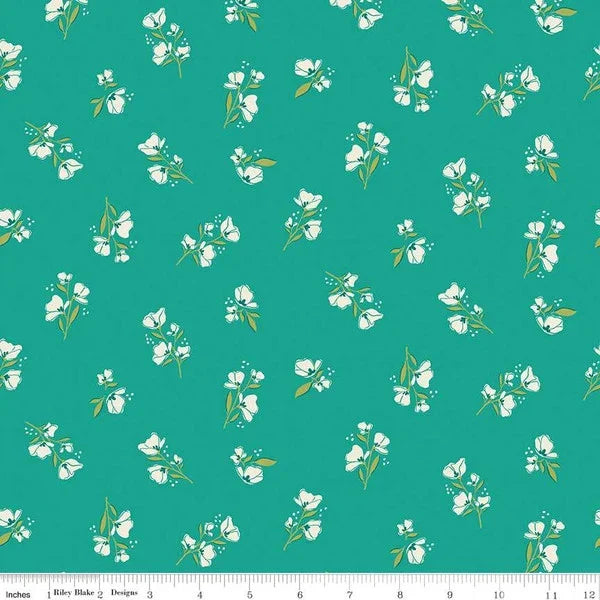 Teal cotton fabric with scattered white blossom and small blue flower pattern