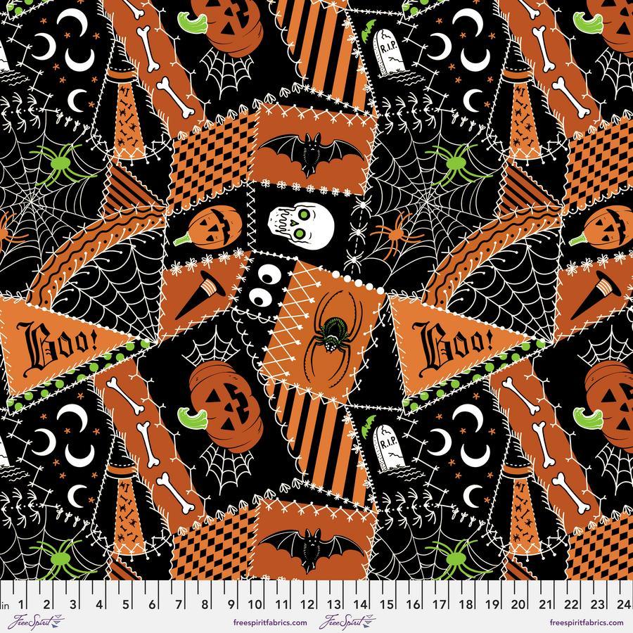 Halloween cat quilt fabric with orange and black patchwork shapes, bats, pumpkins, spiderwebs