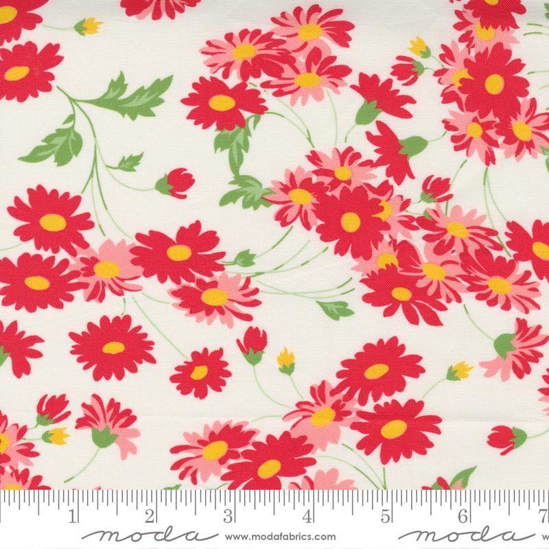 Floral cotton fabric with white background and red, pink, and yellow daisies
