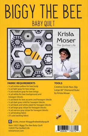Baby quilt pattern cover with hexagon bee fabric diagram in black, gray, and yellow
