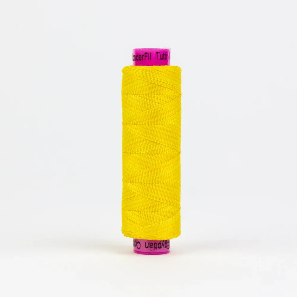 Yellow sewing thread spool with printed label