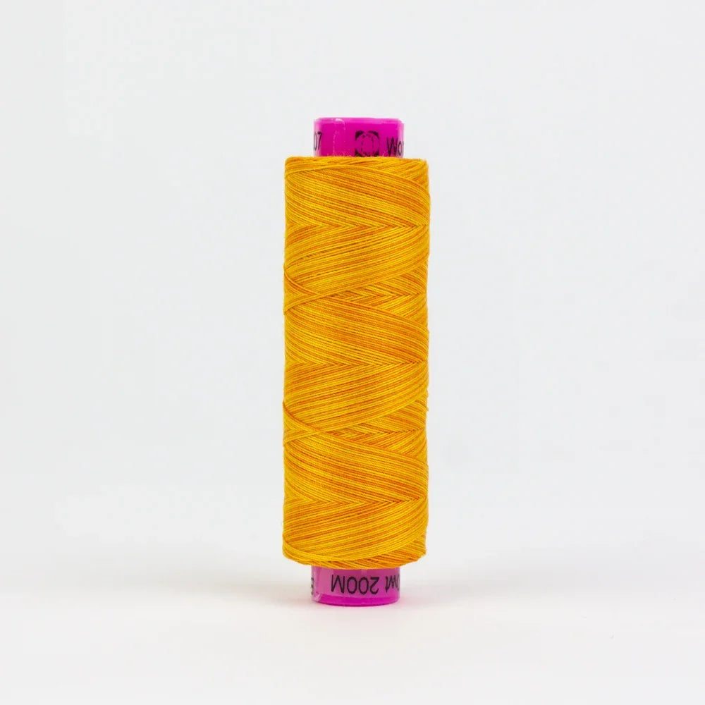 Orange yarn thread spool with visible wound strands