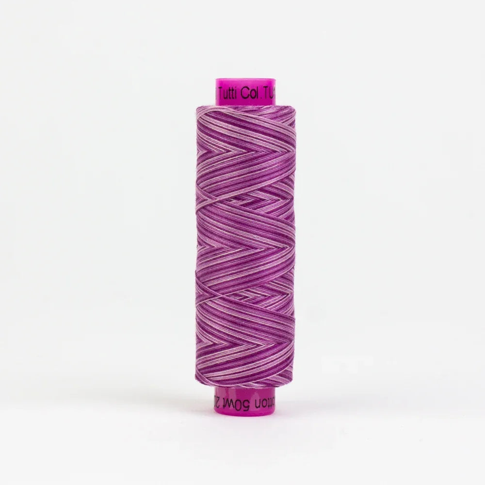 Purple yarn spool with tightly wound thread