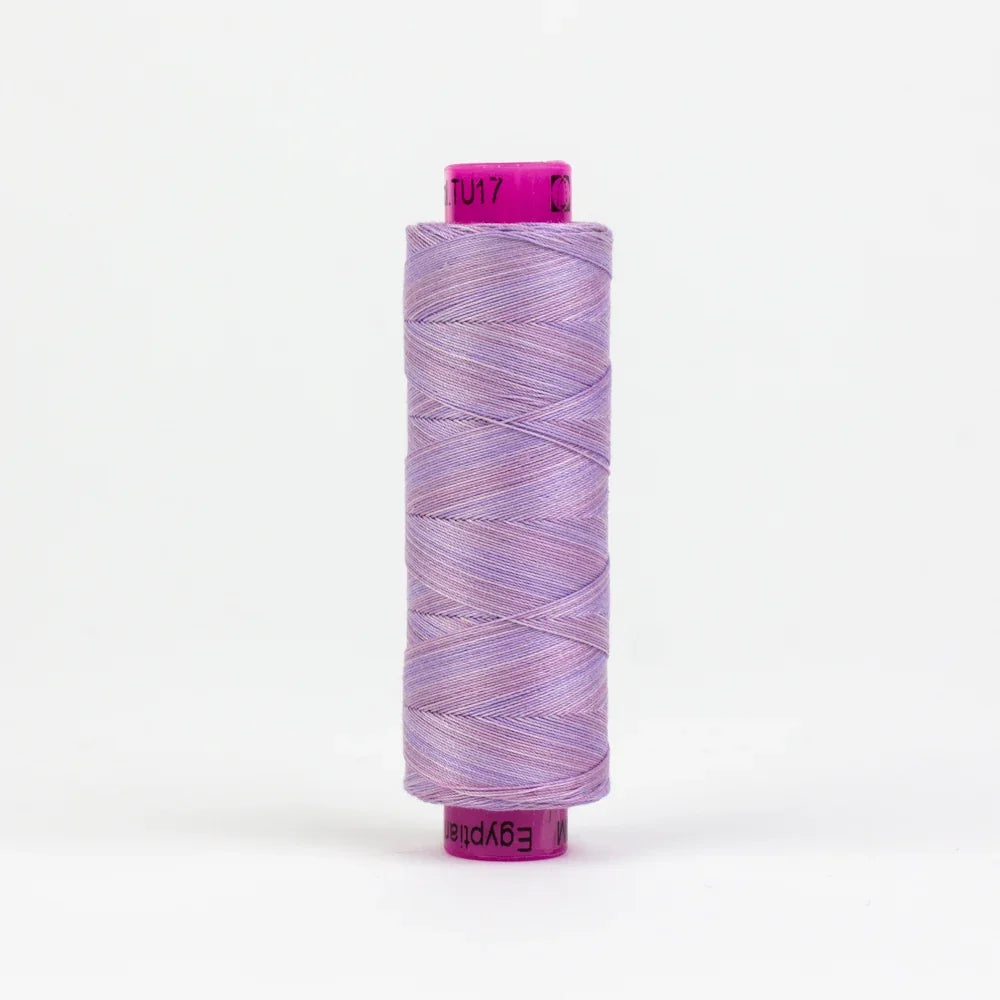 Lavender and purple thread spool with variegated mountain-like dye pattern