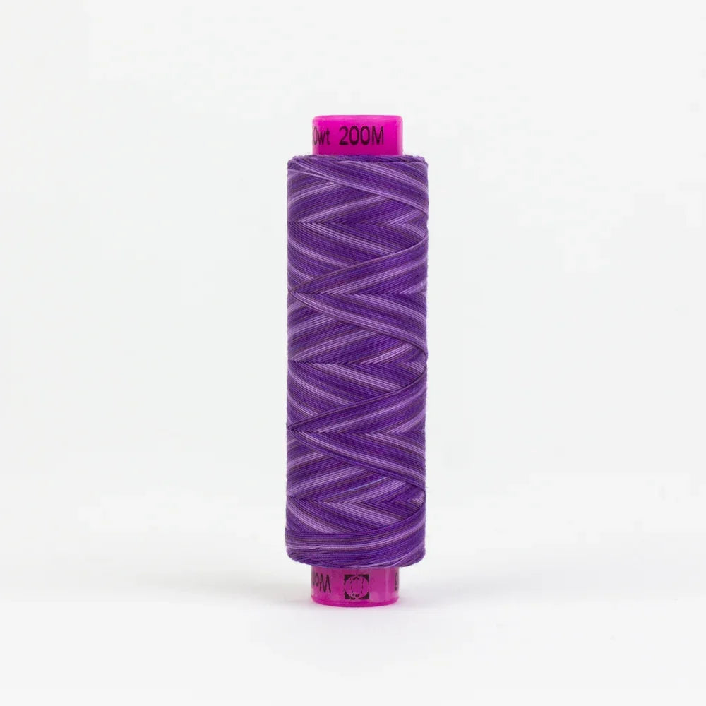 Spool of purple sewing thread with textured winding