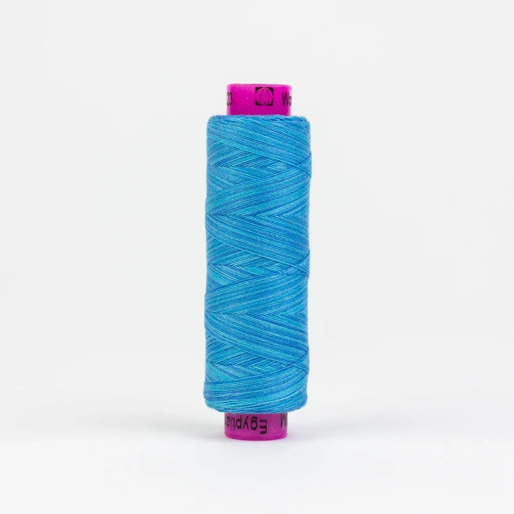 Sea blue yarn spool with visible wound thread and purple label ends