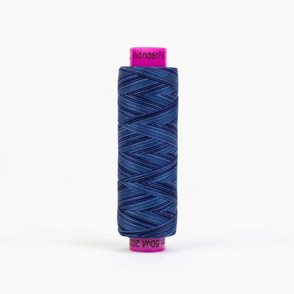 WonderFil Blue Night yarn spool, dark blue twisted thread wound on a reel
