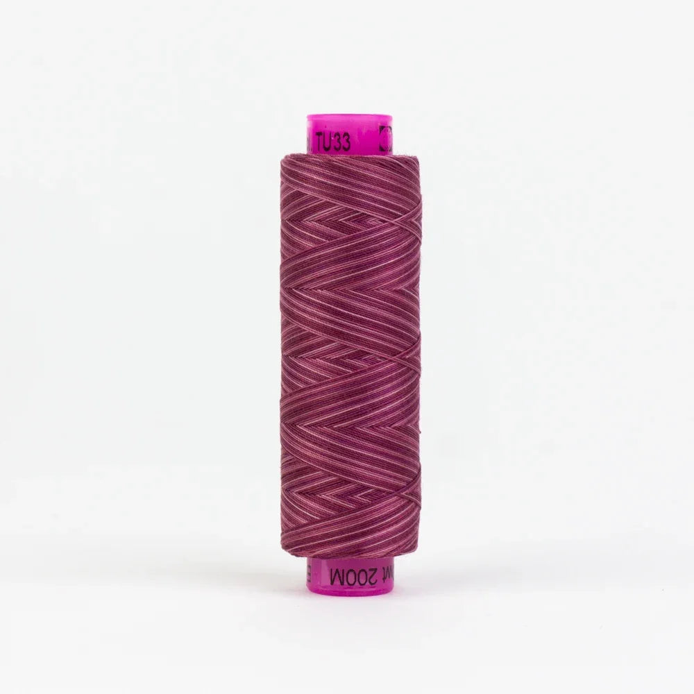 Tutti Moss yarn spool in deep maroon with purple end labels