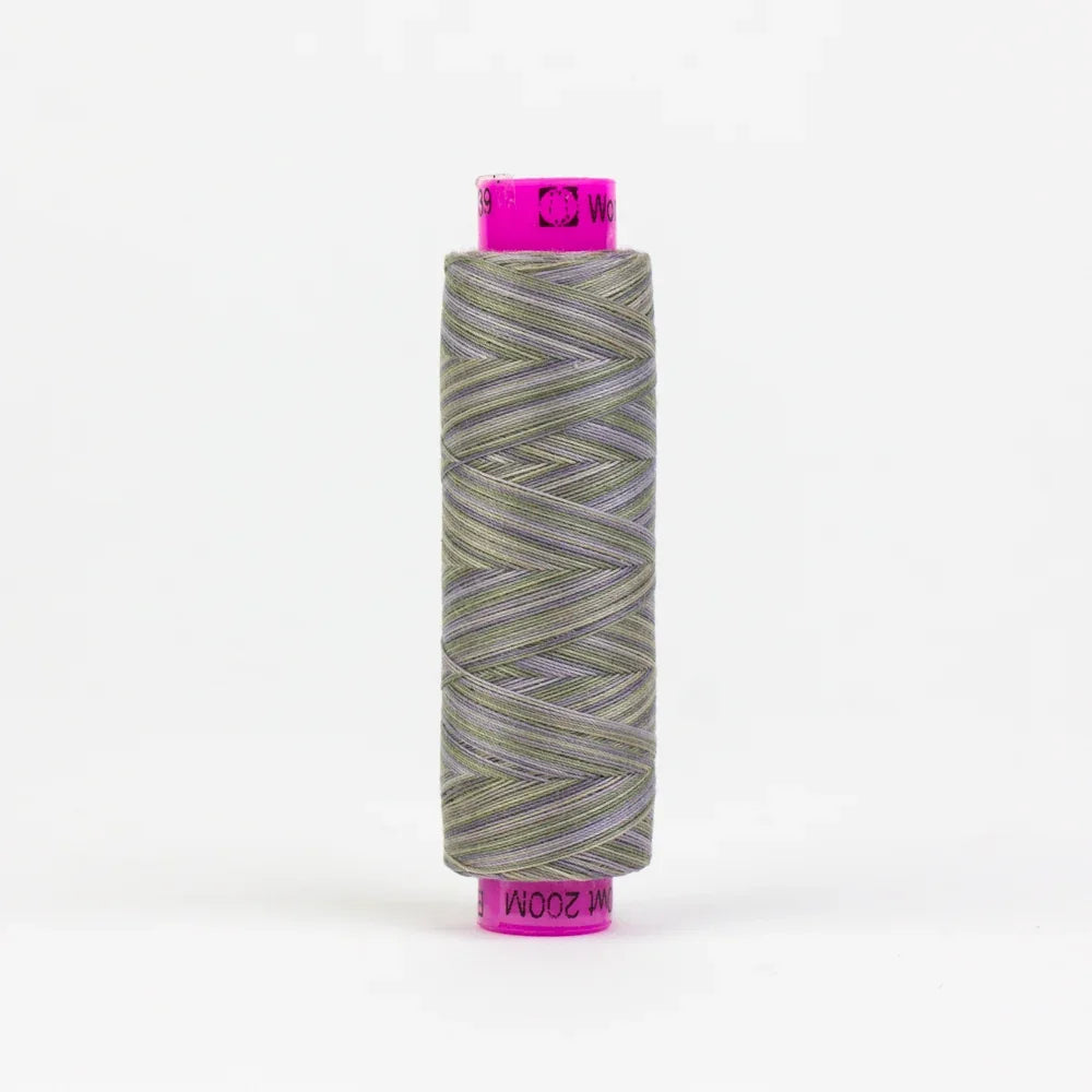 Yarn spool with gray-green multicolor thread, pink label top and bottom