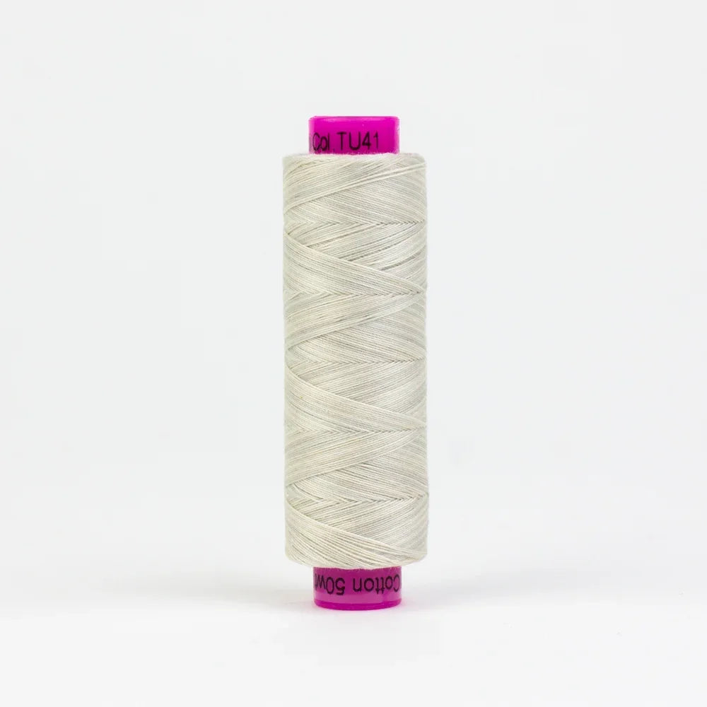 Tutti Lamb yarn spool, light gray twist yarn with threaded label