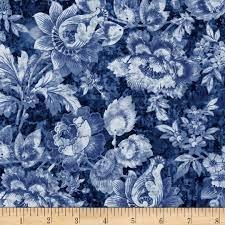 Blue floral printed fabric with stamped blossoms