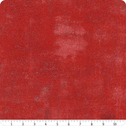 Red glitter fabric with speckled grunge texture