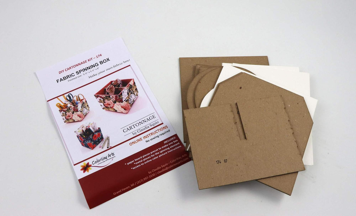 Cartonnage spinning box kit with instruction leaflet and cardboard sheets