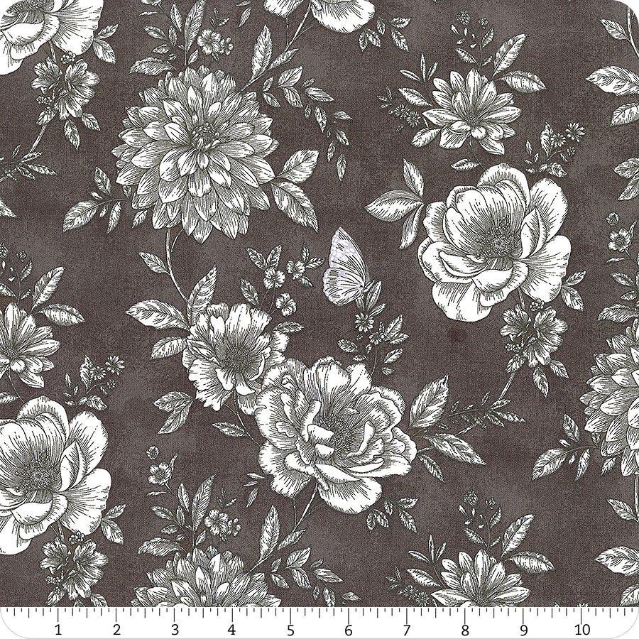 Cotton fabric swatch with dark graphite background and white floral sprigs pattern