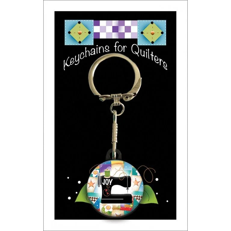 Joy sewing-machine keychain with multicolor patchwork charm and metal keyring