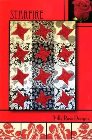 Quilt pattern design with red star blocks and cream-and-black floral prints