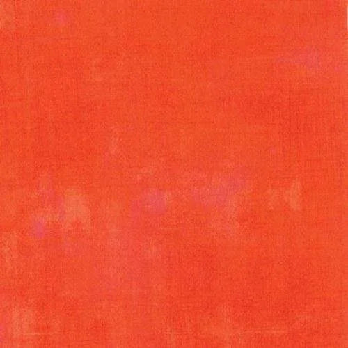Cotton fabric in tangerine orange with subtle grunge texture