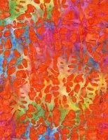 Batik fabric with water-streak multicolor pattern in orange, red, yellow, blue, and purple