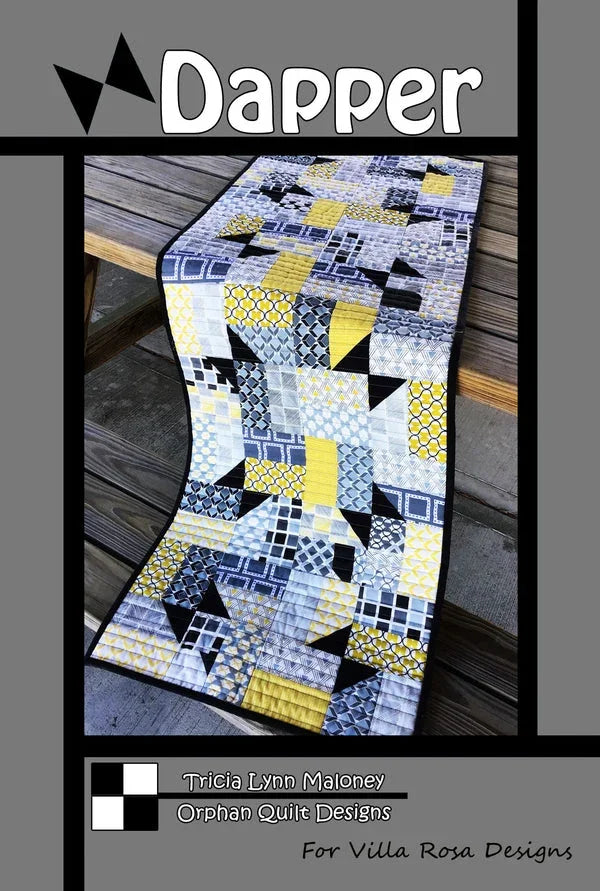 Quilt pattern for tablerunner, geometric blue and white blocks with yellow accents