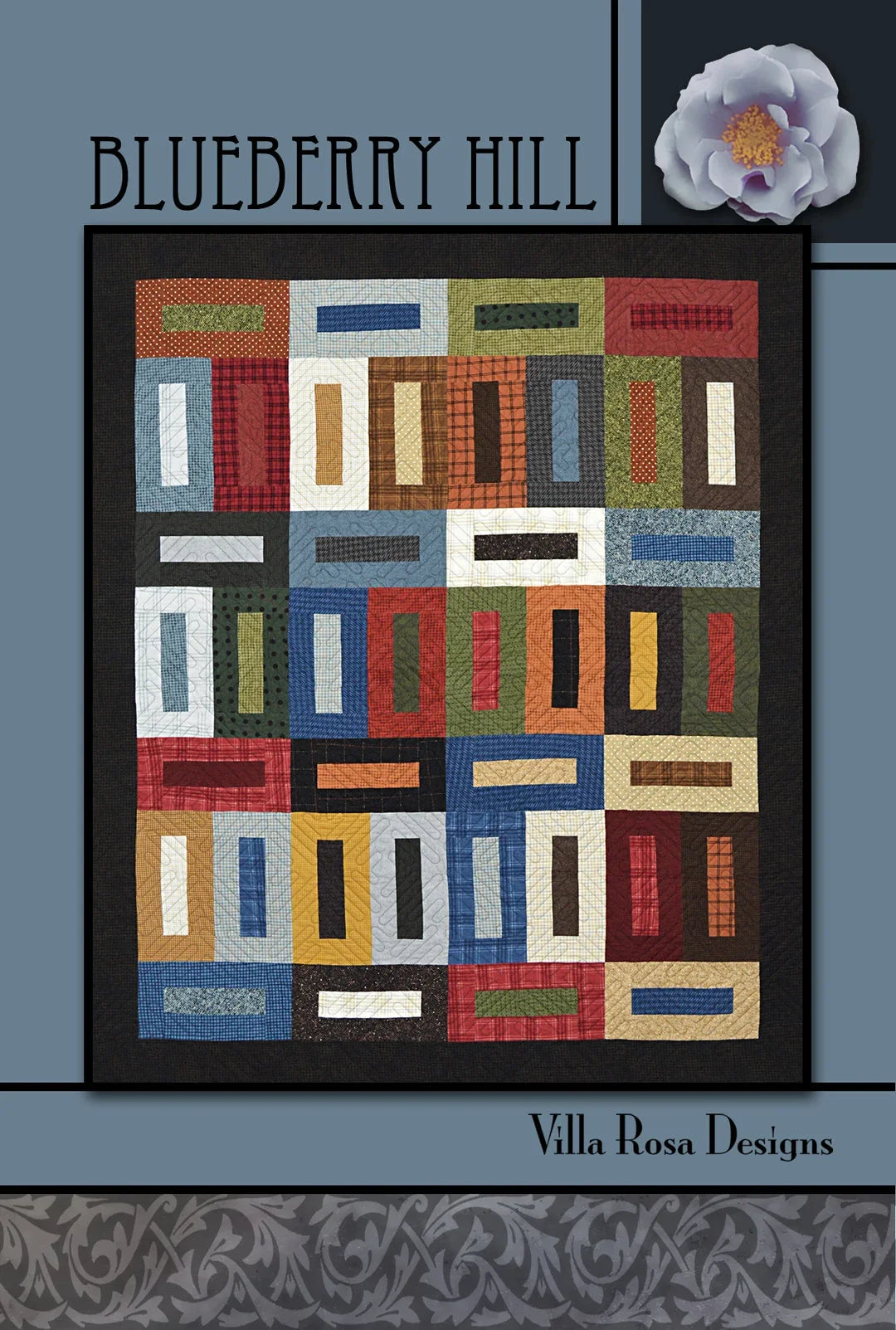 Quilt pattern featuring multicolored rectangular blocks on a dark background