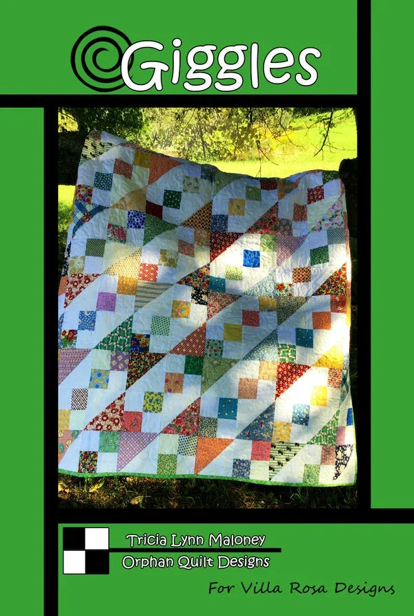Patchwork quilt top with colorful square blocks and white sashing