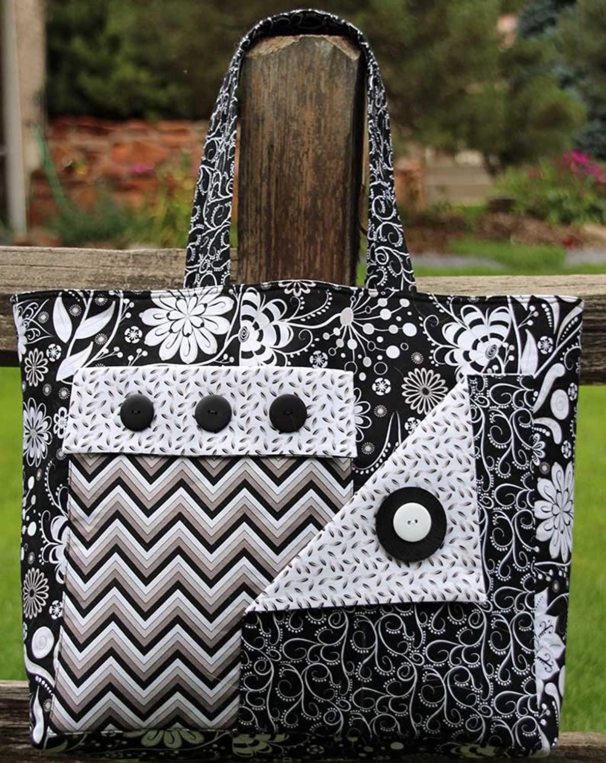 Black and white patterned tote bag with three front patch pockets and button closures
