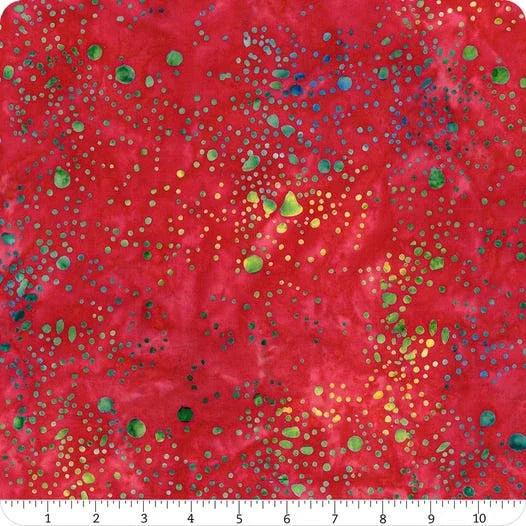 Red paint splatter fabric with green, blue, and yellow dots