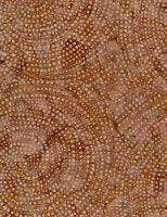 Batik fabric with dotty spiral pattern in tan and warm brown