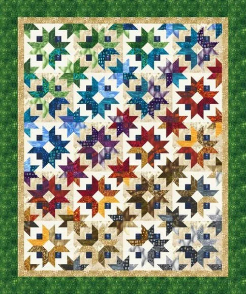 Quilt top featuring multicolor star blocks and light border