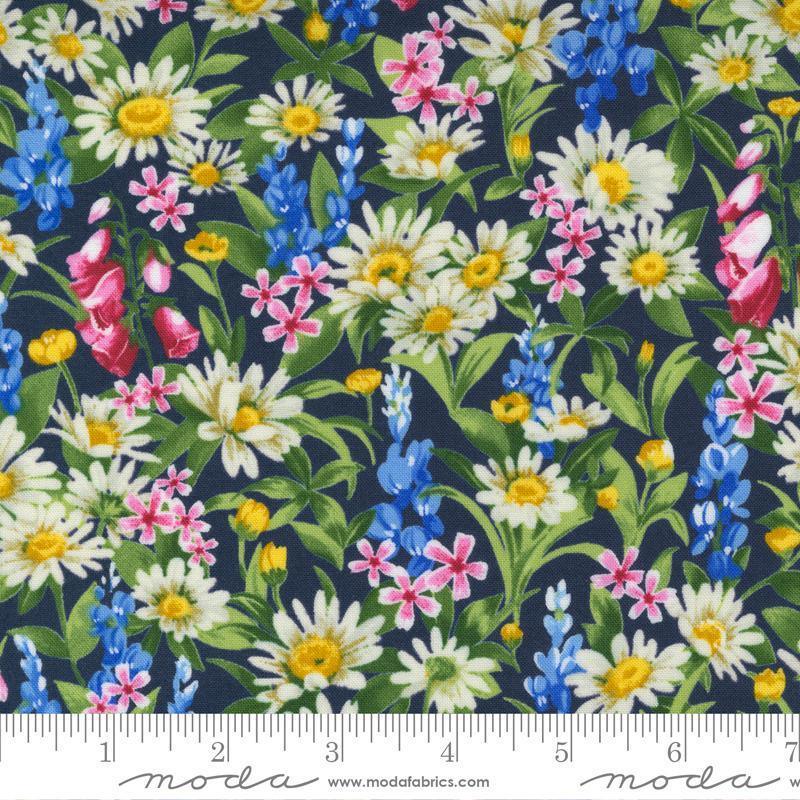 Indigo floral fabric with white, yellow, pink, and blue wildflower print