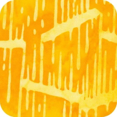Batik fabric swatch with yellow ground and orange drips pattern