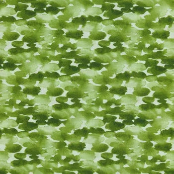 Green fabric with white clover-shaped dot pattern