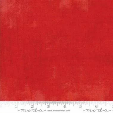 Scarlet red fabric swatch with subtle grunge texture